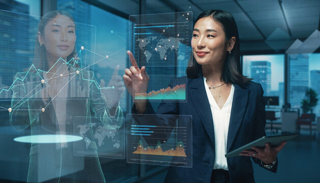 Businesswoman Interacting with Digital Data Visualization in Modern Office