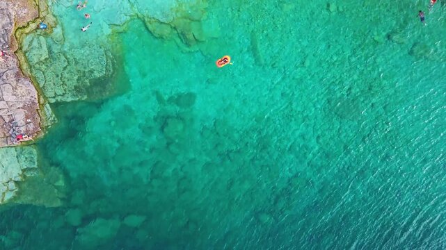 Bruce Penisula National Park, Canada - May 8 2026: Rugged limestone cliffs and crystal-clear turquoise waters frame the Georgian Bay shoreline near the famous Grotto in Bruce Peninsula National Park