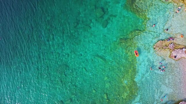 Bruce Penisula National Park, Canada - May 8 2026: Rugged limestone cliffs and crystal-clear turquoise waters frame the Georgian Bay shoreline near the famous Grotto in Bruce Peninsula National Park