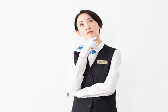 制服を着たアテンダントの女性　旅行イメージ