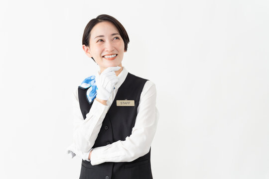 制服を着たアテンダントの女性　旅行イメージ