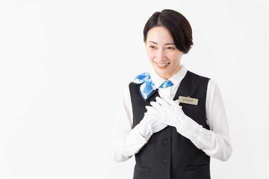 制服を着たアテンダントの女性　旅行イメージ