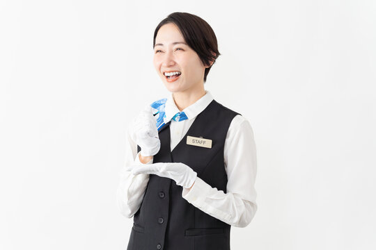 制服を着たアテンダントの女性　旅行イメージ