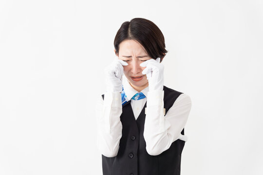 制服を着たアテンダントの女性　旅行イメージ