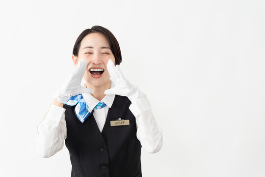 制服を着たアテンダントの女性　旅行イメージ