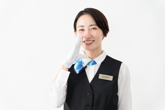 制服を着たアテンダントの女性　旅行イメージ