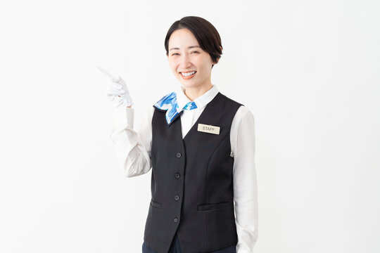 制服を着たアテンダントの女性　旅行イメージ