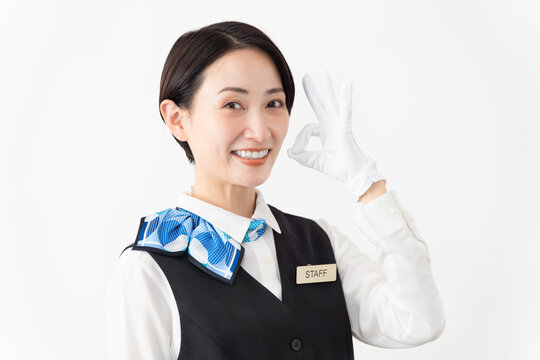 制服を着たアテンダントの女性　旅行イメージ