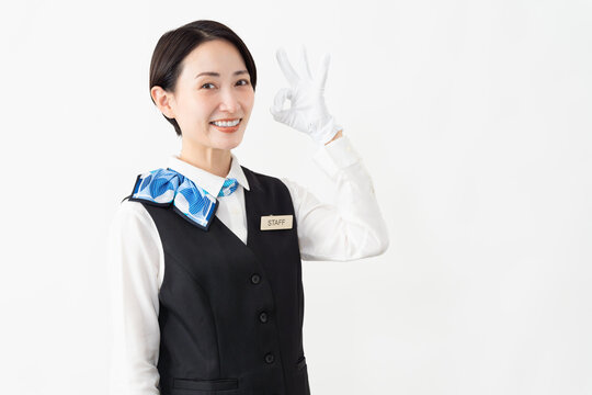 制服を着たアテンダントの女性　旅行イメージ