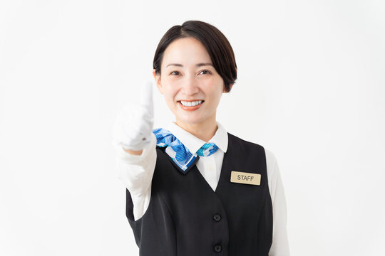 制服を着たアテンダントの女性　旅行イメージ