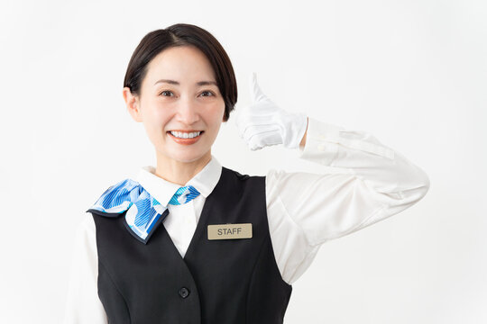 制服を着たアテンダントの女性　旅行イメージ