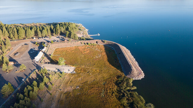 Aerial view of Gallatin Marina at Eagle Lake, Lassen County, California showing dried exposed lakebed and breakwater due to prolonged drought.