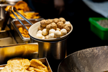 Fototapeta premium the authentic charm of iconic Taiwanese street food ingredients—Fish Balls and Pork Meatballs