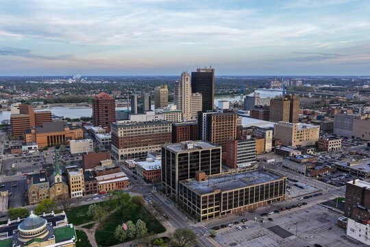 Toledo, United States - 17 April 2026: Aerial view of the downtown skyline featuring historic buildings, modern office towers, and the Maumee River under a clear sky.