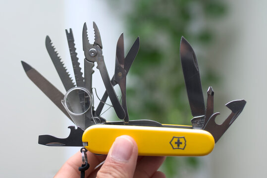 ZAPOPAN, MEXICO - JULY 28, 2026: Hand holding Victorinox Swiss Army knife with open tools.