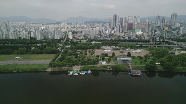 4K Drone of Hangang River by Gwangnaru Hangang Park and Gwangjin Bridge on a Cloudy Day