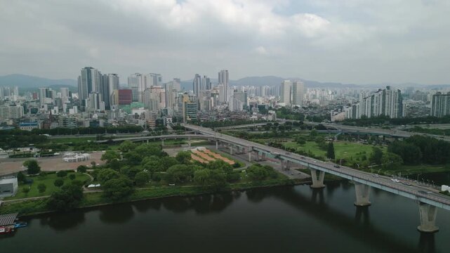 4K Drone of Hangang River by Gwangnaru Hangang Park and Gwangjin Bridge on a Cloudy Day