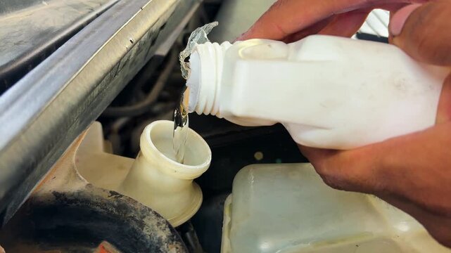 Close Up Of Brake Fluid Refill During Professional Automotive Service And Repair