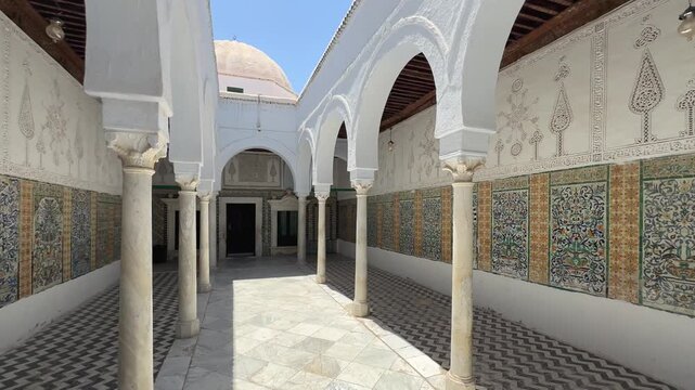 Historic Islamic courtyard with marble columns in Zawiya of Sidi Sahib also known as the Zawiya of Abu al-Balawi or Mosque of the Barber in Kairouan, Tunisia.