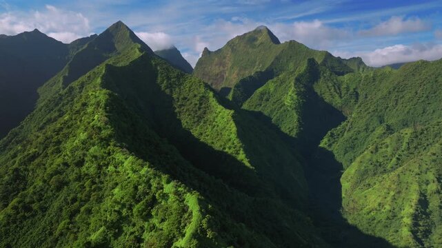 Tahiti ito Volcano Tara Huhurahi Ridge volcano mountains of Teahupo'o South Pacific Island French Polynesia aerial drone sunny afternoon Mount Ronui Aorai Orohena Vaiau River Valley forward pan up