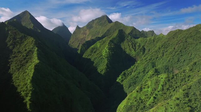 Tahiti Ito Volcano Tara Huhurahi Ridge mountains of Teahupo'o South Pacific Island French Polynesia aerial drone afternoon sunny blue sky clouds Mount Ronui Aorai Orohena Vaiau River Valley forward
