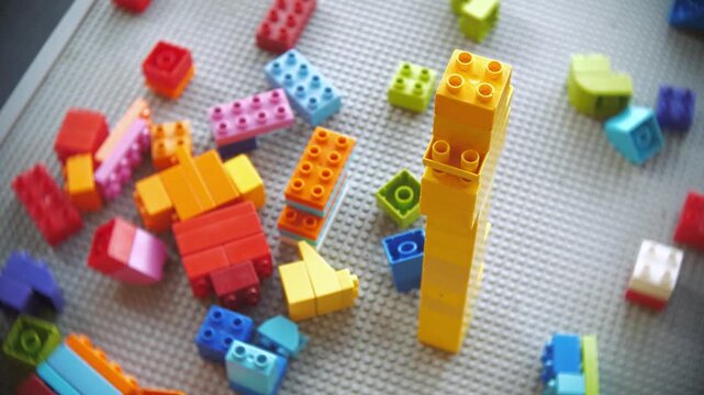 Toy building blocks on a play table in a kids section of library.