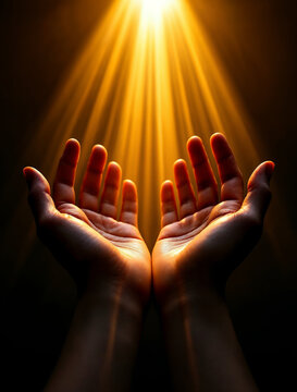 Open human hands raised up towards a bright golden divine light beam in prayer and worship against a dark background