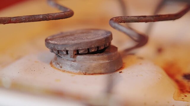 Aging kitchen appliance reveals authentic wear, grime and forgotten daily routine.
