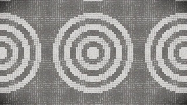 Modern grey and white mosaic pattern with concentric circles, seamless loop.