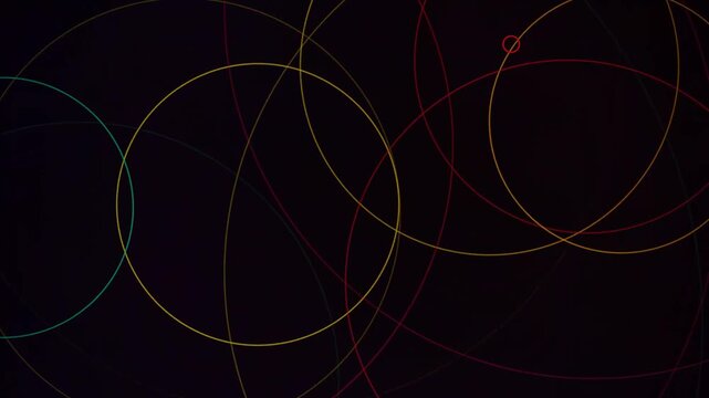 Minimalist abstract animation with overlapping colorful geometric circles on a dark background.