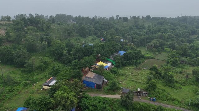 Aerial drone view of Kanwar Yatra pilgrims walking along the sacred route from Sultanganj to Deoghar during Shravan, capturing devotion, crowds, colorful kanwars, and India's largest annual pilgrimage