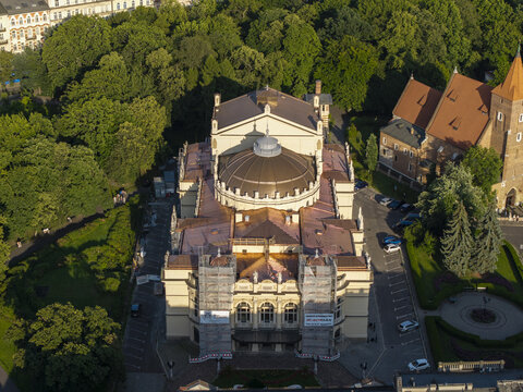 Krakow, Poland - 20 July 2026: Aerial view of the historic Juliusz Slowacki Theatre in Krakow Old Town, featuring its dome, ornate roof, and surrounding parkland during renovation.
