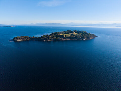 The small inhabited Satellite Island surrounded by blue waters of the D'Entrecasteaux Channel