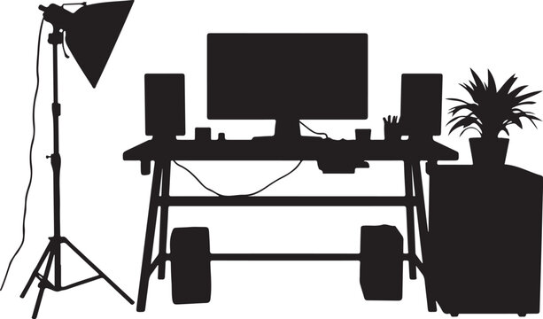 Black silhouette of a home office desk setup with a computer monitor, speakers