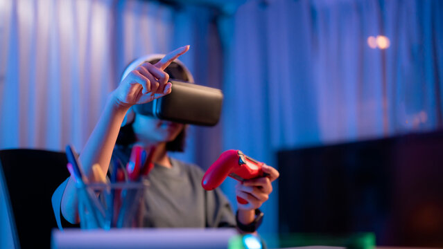 Exciting virtual reality gaming experience at home in a colorful room during the evening