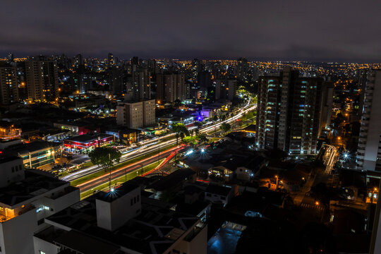 Bauru, SP, Brazil. May 15, 2026: High-angle view of the urban cityscape and avenue traffic with car light trails at night in Bauru