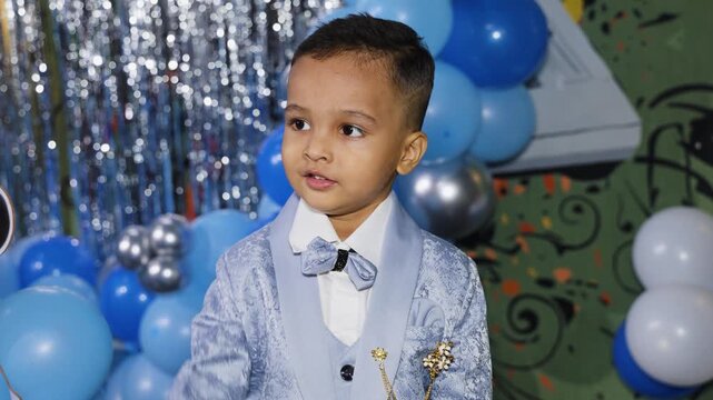 Smiling Little Birthday Boy Wearing Elegant Party Suit at Third Birthday Celebration