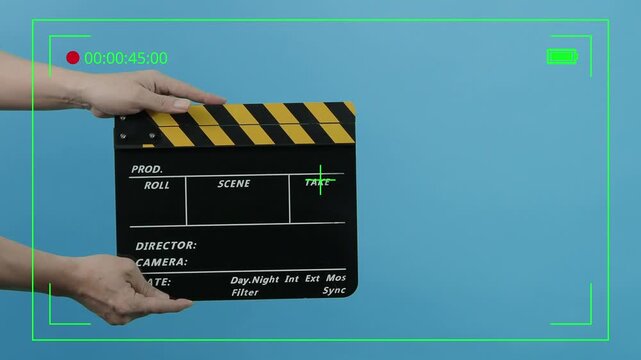 Director Film Slate. Film crew hold and clapping film slate in video recording.