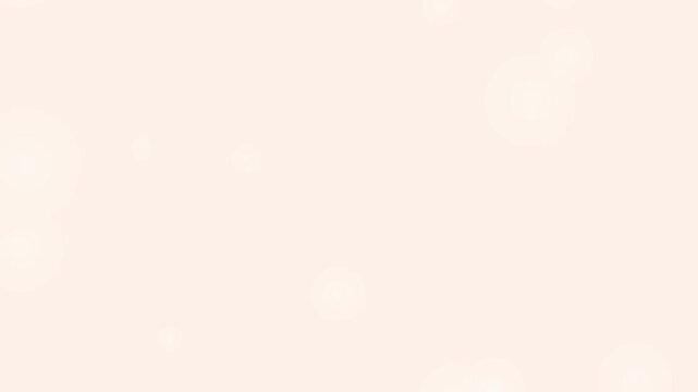 An elegant soft cream background features floating bokeh light particles.
