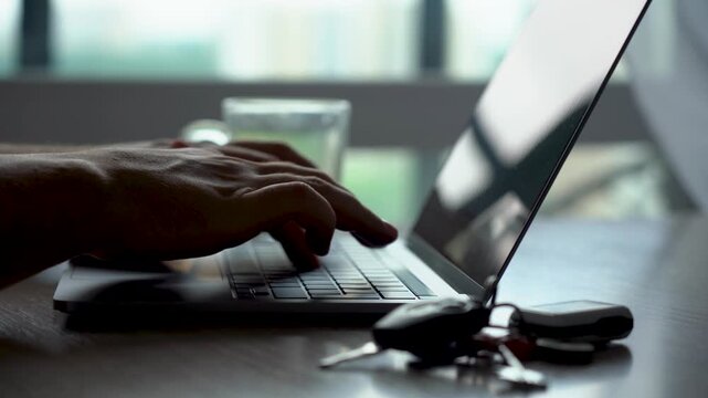 A Quiet Moment of Reflection at Home: Enjoying Coffee While Typing on a Laptop in a Cozy and Modern Setting with Soft Natural Light