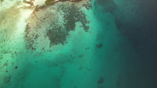 Los Roques, Venezuela - 28 December 2024: Aerial view of the turquoise waters and coral reefs of the Los Roques archipelago.