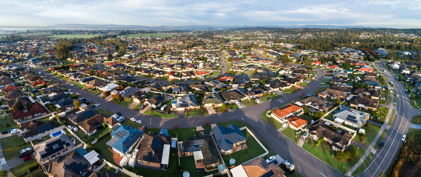 Aerial townscape of residential suburb of country town in Australia on sunlit morning