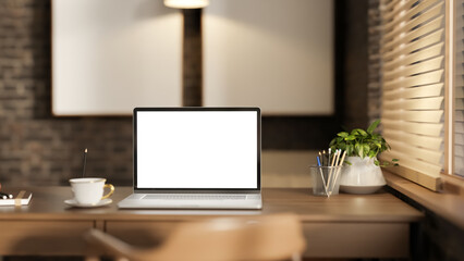 Fototapeta premium Modern Home Office Workspace with Laptop on Wooden Desk and Window Light
