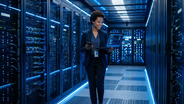 Confident cybersecurity expert walking through a modern high-tech server room with glowing blue LED lights