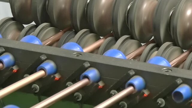 In a bustling factory, watch as machines expertly shape copper tubes for industrial air conditioning units. Each frame captures the precision and beauty of this essential manufacturing process.