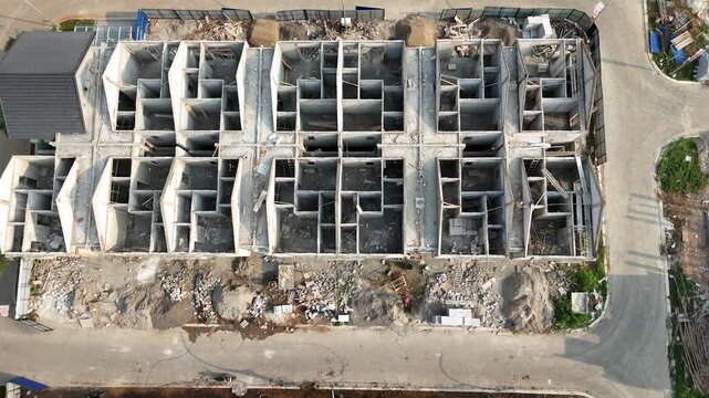 Kecamatan Sepatan, Banten, Indonesia - 08 July 2026: Aerial view of Jaya Imperial Park construction site showing concrete housing frames and surrounding infrastructure.