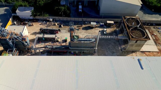 Merida, Yucatan, Mexico - 08 July 2026: Aerial view of the cement and asphalt plant featuring industrial machinery, silos, and large storage structures.