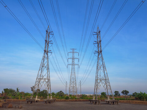 Power Lines and Transmission Towers Under Blue Sky