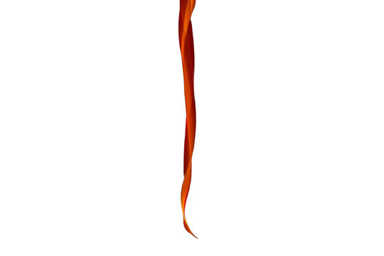 Abstract flowing orange light trail on black background
