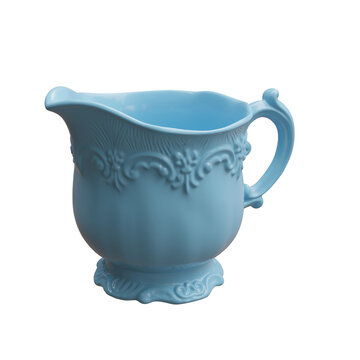 Ornate blue ceramic cream pitcher with a flared spout, curved handle, and embossed floral trim, isolated on white transparent